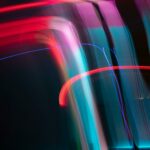 Dynamic and colorful long exposure light streaks in an abstract artistic composition.